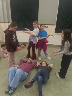 After a drama session and some toast, children are chilling before bed.